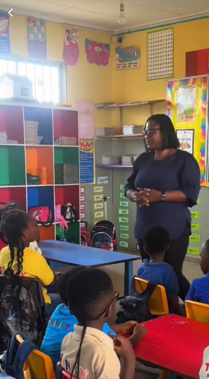 A teacher guiding pupils during a lesson at Humble Dream Montessori School