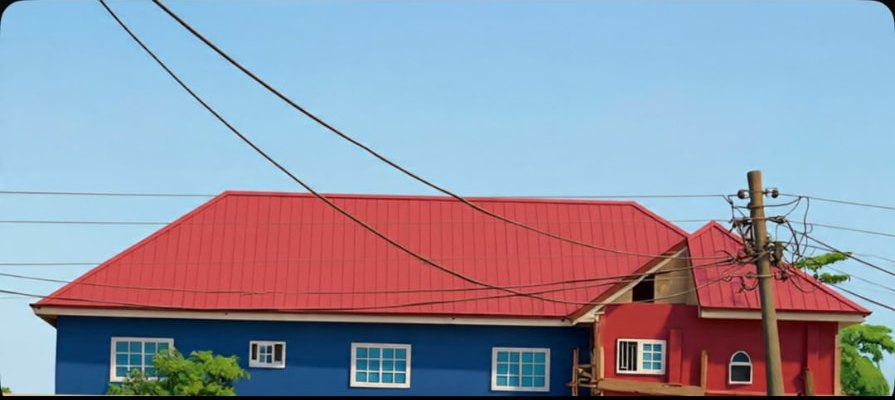 Wide view of the school buildings under a clear blue sky